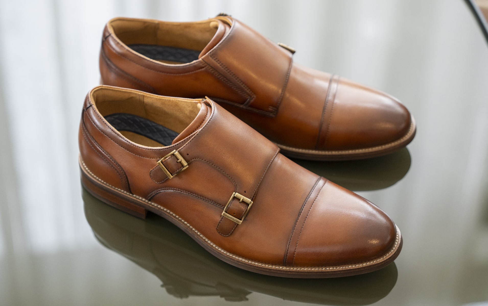 Image features the Rucci double monk oxford in cognac.