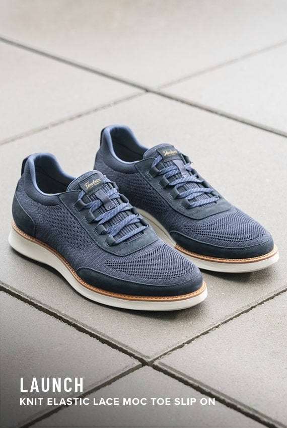 Shoes for Men view all category. Image features the Launch Knit in navy. 